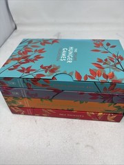 The Deluxe Hunger Games collection paperback + hard cover sunrise on the reaping